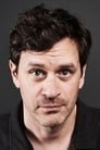 Tom Everett Scott isGarrett