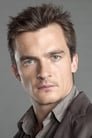 Rupert Friend isDennis Nylon